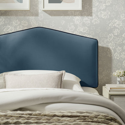 Cosette Performance Velvet Headboard in blue velvet with dark piping against patterned wallpaper on Tampa Home & Garden Store