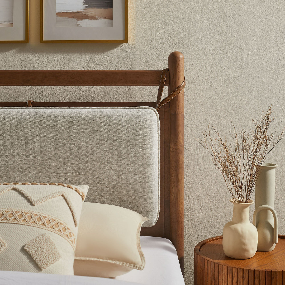 Leni wood platform bed frame with beige bed skirt and warm oak posts in a neutral bedroom on Tampa Home & Garden Store