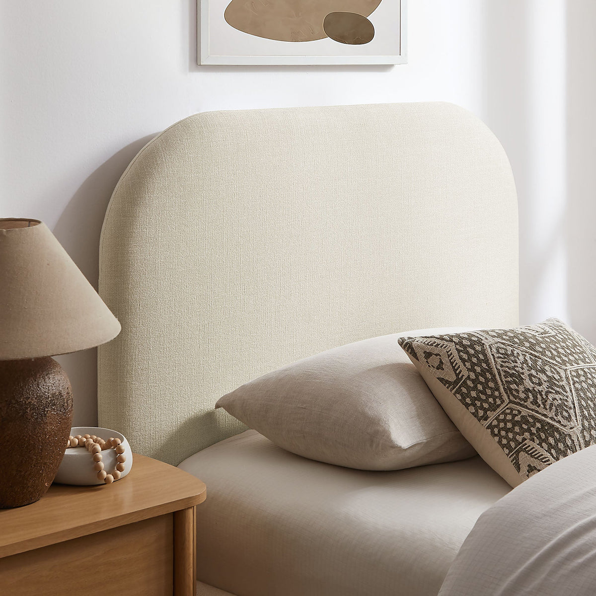 Keynote fabric upholstered storage platform bed frame in beige with headboard in a room on Tampa Home & Garden Store