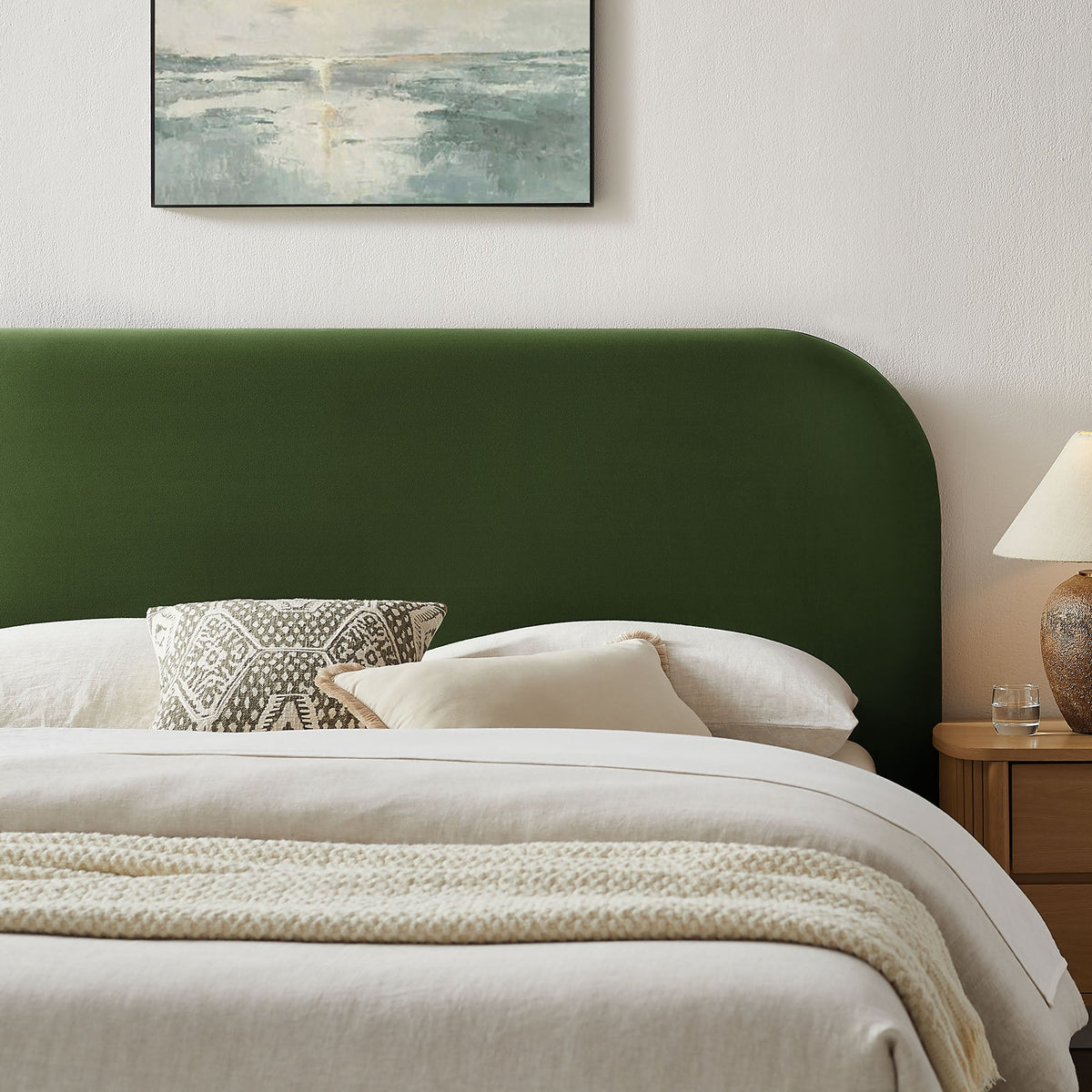 Keynote Velvet storage bed frame with emerald headboard, two white pillows and patterned pillow on Tampa Home & Garden Store