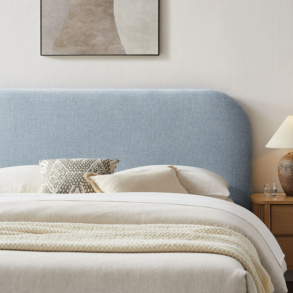 Keynote Fabric Upholstered Storage Platform Bed Frame in blue fabric with beige bedding on Tampa Home & Garden Store
