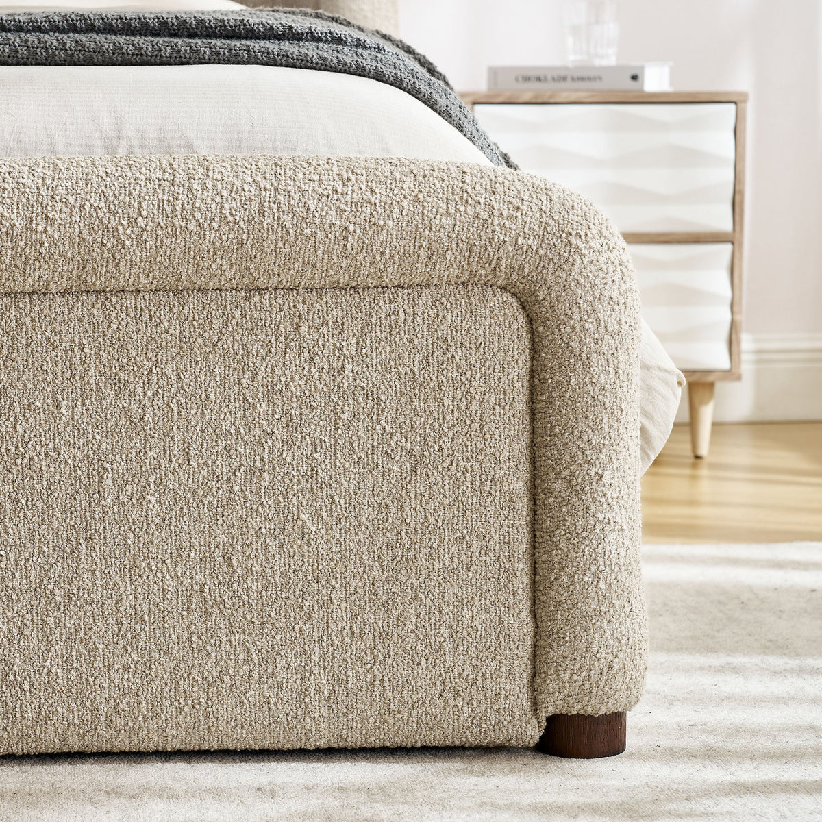 Tasmin upholstered fabric platform bed with beige textured bed skirt on Tampa Home & Garden Store