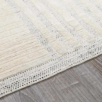 Yulia Wool Area Rug by Boutique Rugs, cream with subtle tan stripes and dotted border on Tampa Home & Garden Store