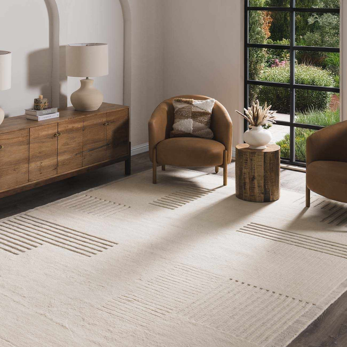 Yulia Wool Area Rug Boutique Rugs, cream with textured stripes in a neutral living room on Tampa Home & Garden Store