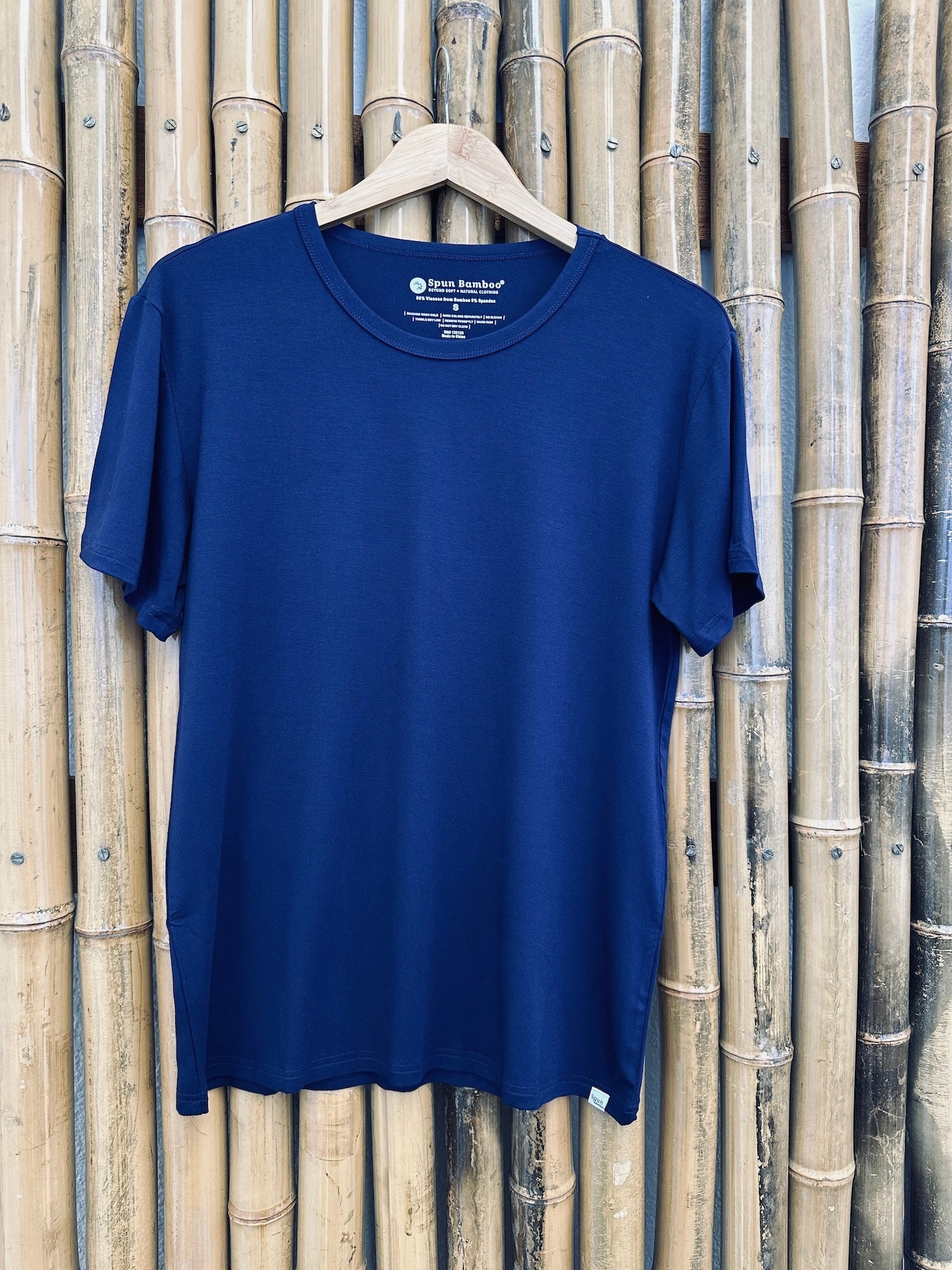 Men's Soft Bamboo Lounge Short Sleeve T-Shirt navy on hanger with bamboo backdrop Spun Bamboo on Tampa Home & Garden Store