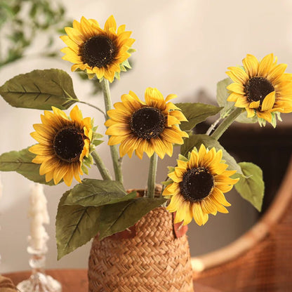 One-Head Sunflower Stem by RusticReach, yellow blooms with green leaves in a woven vase on Tampa Home & Garden Store