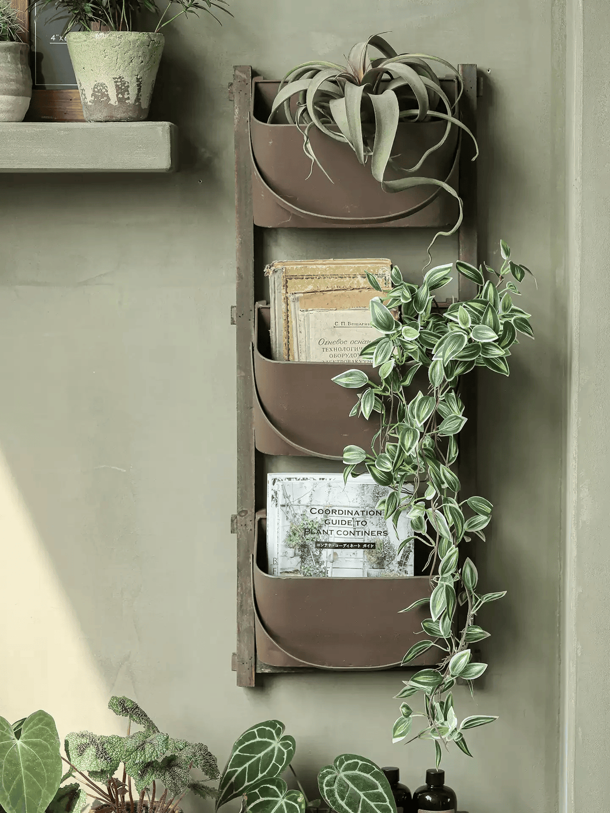 RusticReach Farmhouse Three-Tier Wall Pocket Organizer in brown metal with greenery on Tampa Home & Garden Store