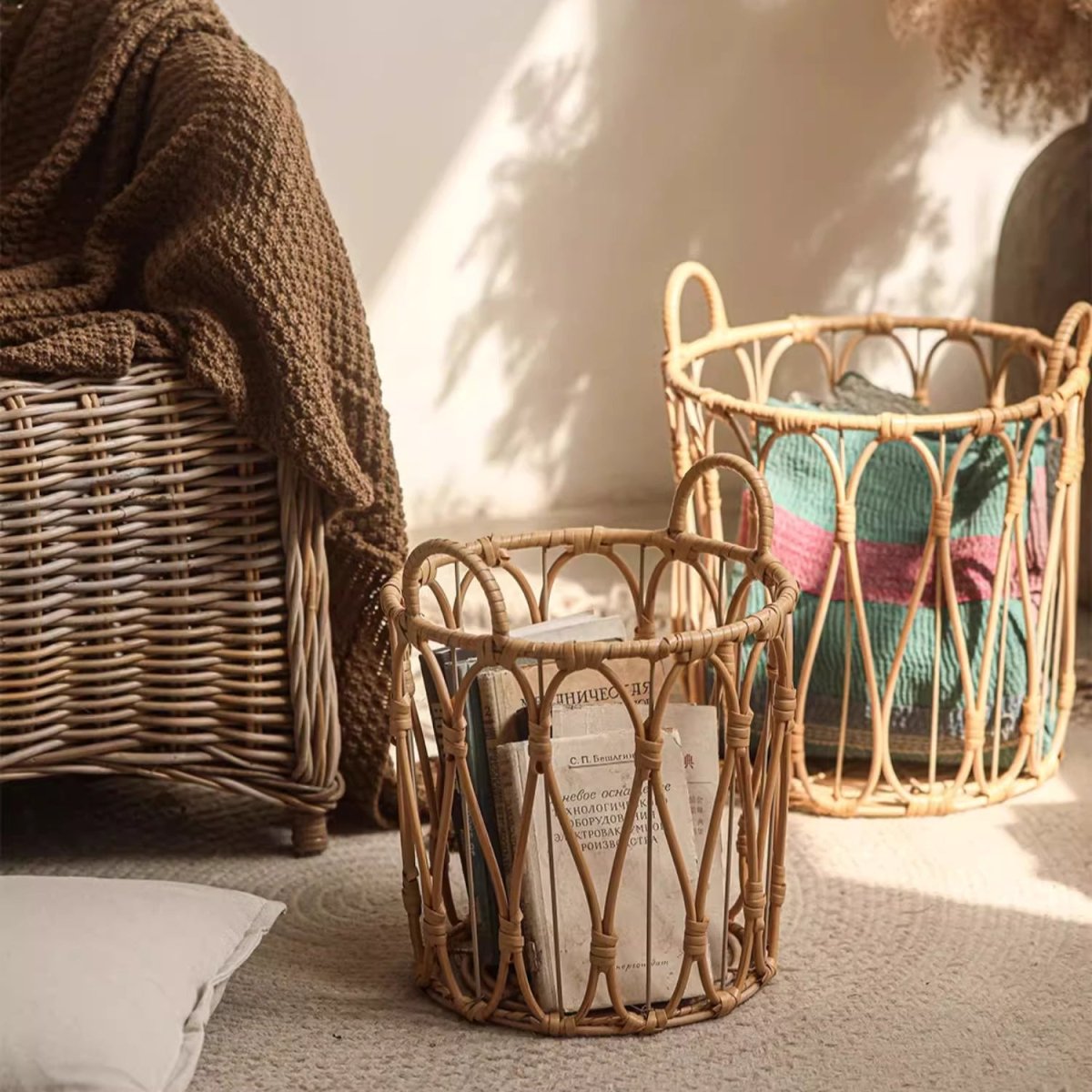 Bohemian open-weave rattan basket by RusticReach; three wicker baskets with blankets on Tampa Home & Garden Store