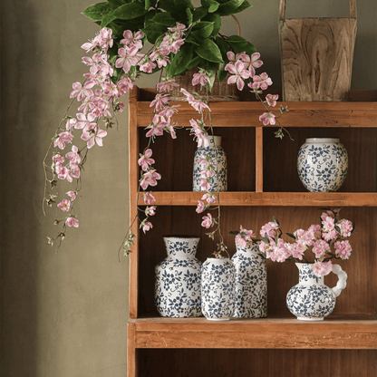 Artificial Cytha Jasmin Stem RusticReach pink cascading blooms over blue vases on shelf on Tampa Home & Garden Store