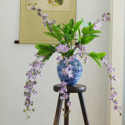 Artificial Cytha Jasmin Stem RusticReach in blue ceramic vase with purple blossoms on Tampa Home & Garden Store