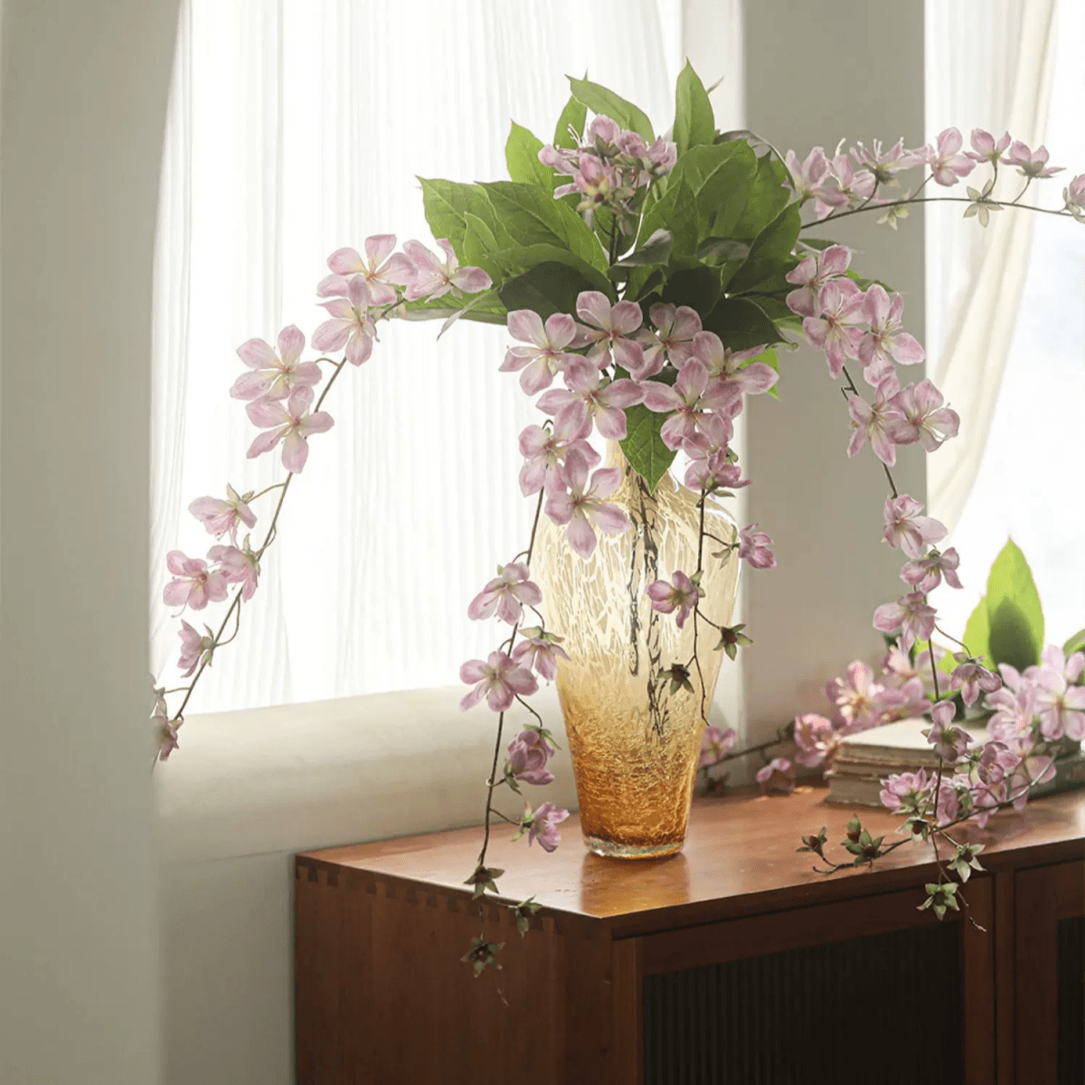 Artificial Cytha Jasmine stem with pink blooms in amber vase and green leaves RusticReach on Tampa Home & Garden Store