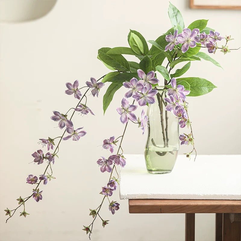 Artificial Cytha Jasmin Stem by RusticReach, purple blossoms with green leaves in a vase on Tampa Home & Garden Store