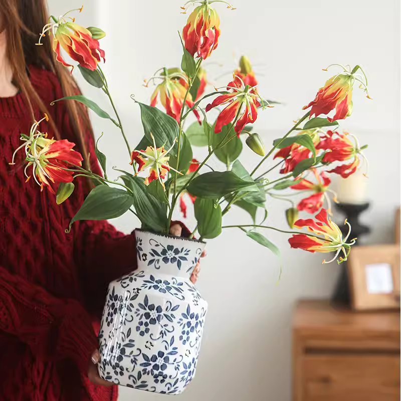 RusticReach Faux Fire Lily Stem 31.9in tall in a blue ceramic vase with red and yellow blooms on Tampa Home & Garden Store
