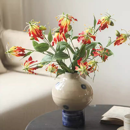 Faux Fire Lily Stem 31.9-inch tall with red-yellow blossoms and green leaves in a ceramic vase on Tampa Home & Garden Store