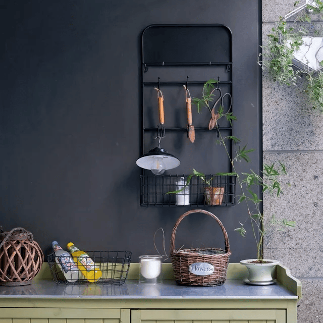 Industrial garden tool storage rack by RusticReach, black steel wall-mount with hooks on Tampa Home & Garden Store