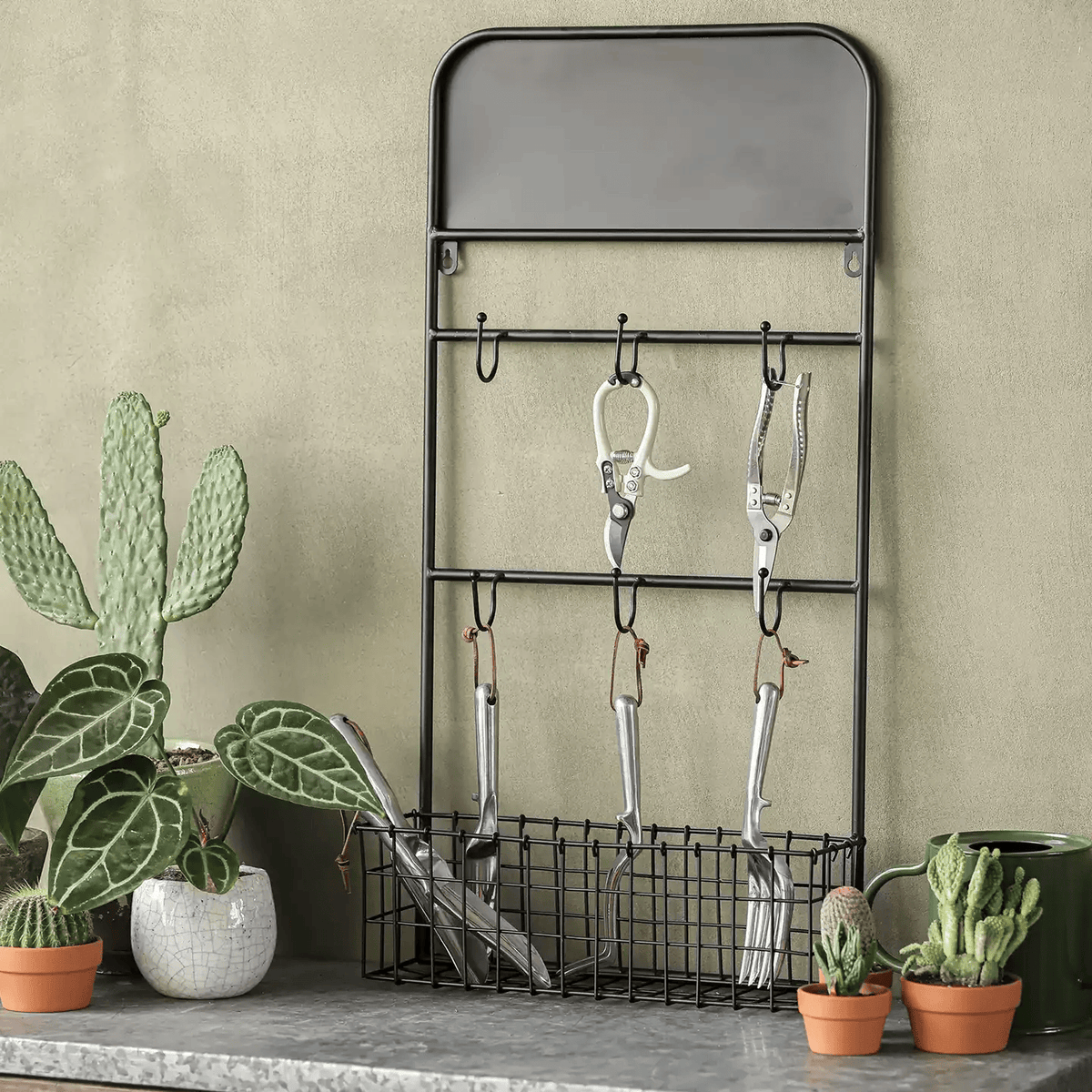Industrial Garden Tool Storage Rack RusticReach black metal with hooks and bottom basket on Tampa Home & Garden Store