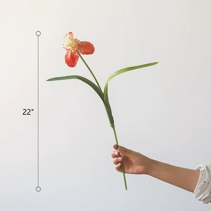 Silk Iris Flower 22 tall RusticReach orange petals and green stem held by hand on Tampa Home & Garden Store