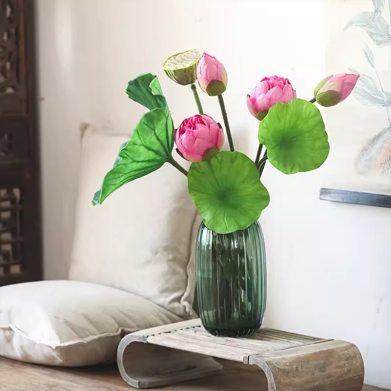Artificial Lotus Flower and Seedpod with pink blooms and green leaves in a dark green glass vase on Tampa Home & Garden Store