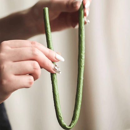 RusticReach artificial lotus flower and seedpod on two green stems held by hands for display on Tampa Home & Garden Store