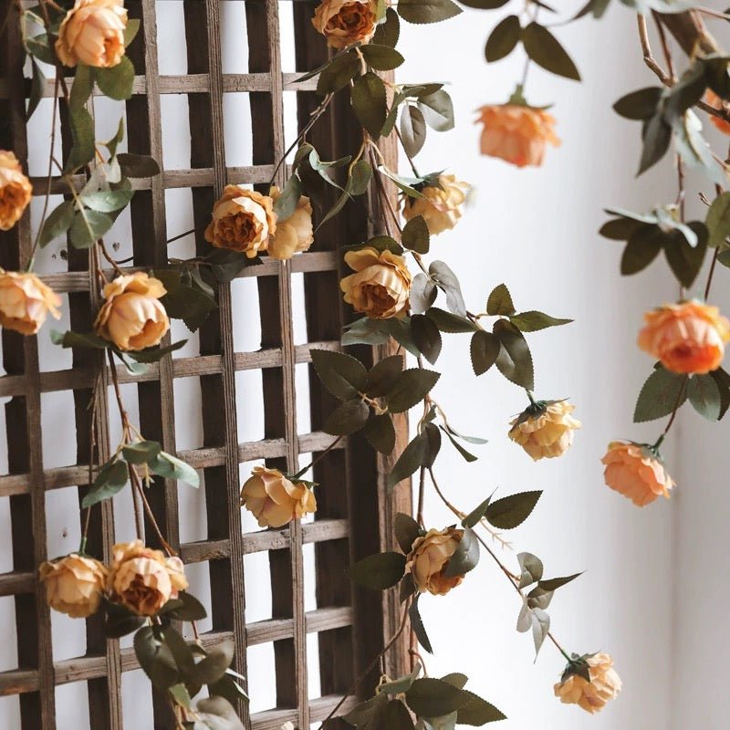 Artificial small peach peony vine by RusticReach, 65in long, draped on a lattice trellis on Tampa Home & Garden Store