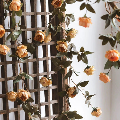 Artificial small peach peony vine by RusticReach, 65in long, draped on a lattice trellis on Tampa Home & Garden Store