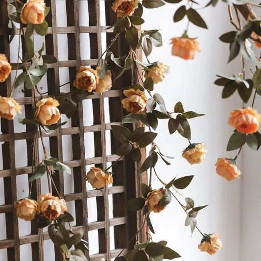 Artificial small peach peony vine by RusticReach, 65in long, draped on a lattice trellis on Tampa Home & Garden Store