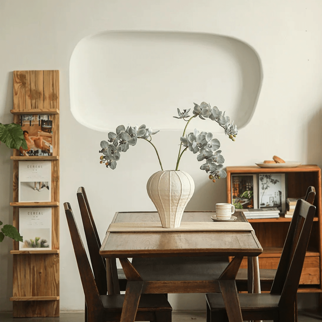 Real Touch Orchid Stem gray-green leaves in a ribbed white vase on wooden dining table on Tampa Home & Garden Store