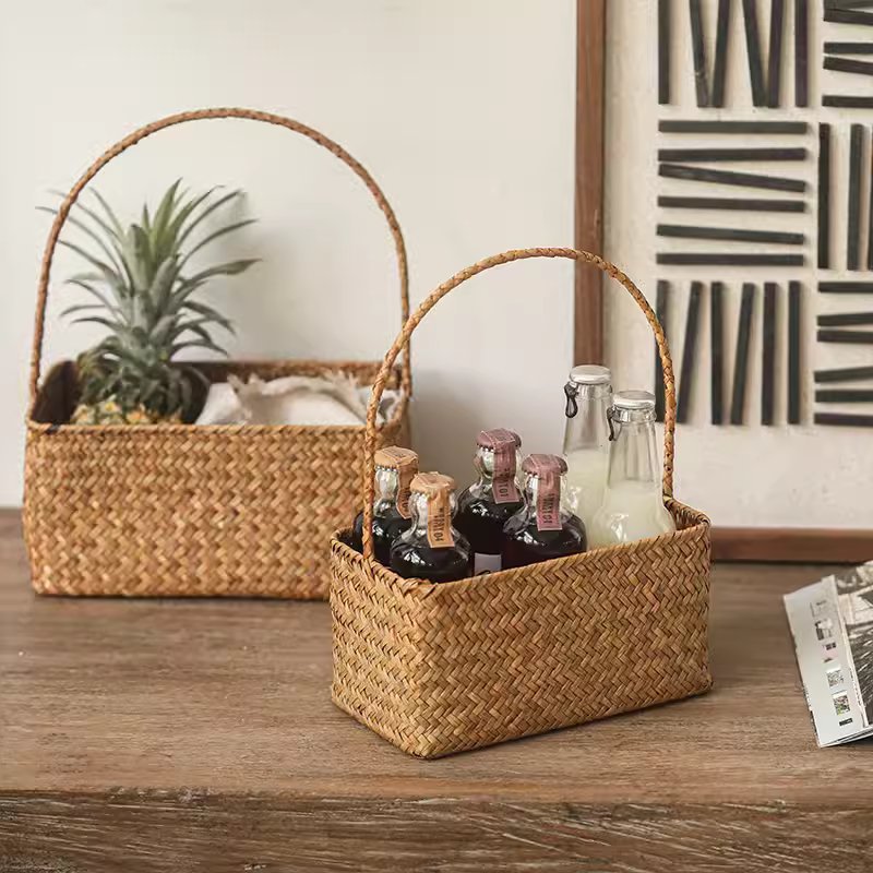Rectangular Woven Carry Basket Organizer 2-pack natural tan wicker; front bottles, back plant on Tampa Home & Garden Store