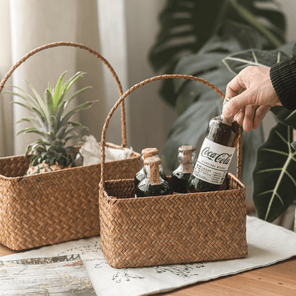Rectangular woven carry basket organizer pair in brown rattan with handles, glass bottles on Tampa Home & Garden Store