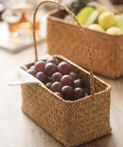Rectangular Woven Carry Basket Organizer by RusticReach natural fiber filled with plums on Tampa Home & Garden Store