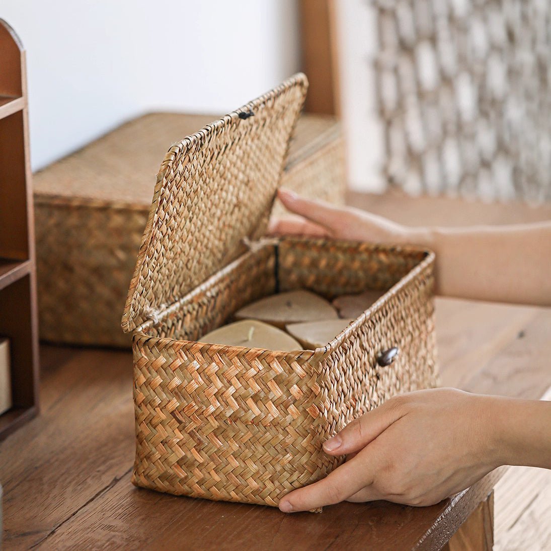 Natural straw storage basket with lid by RusticReach; open lid reveals round discs inside on Tampa Home & Garden Store