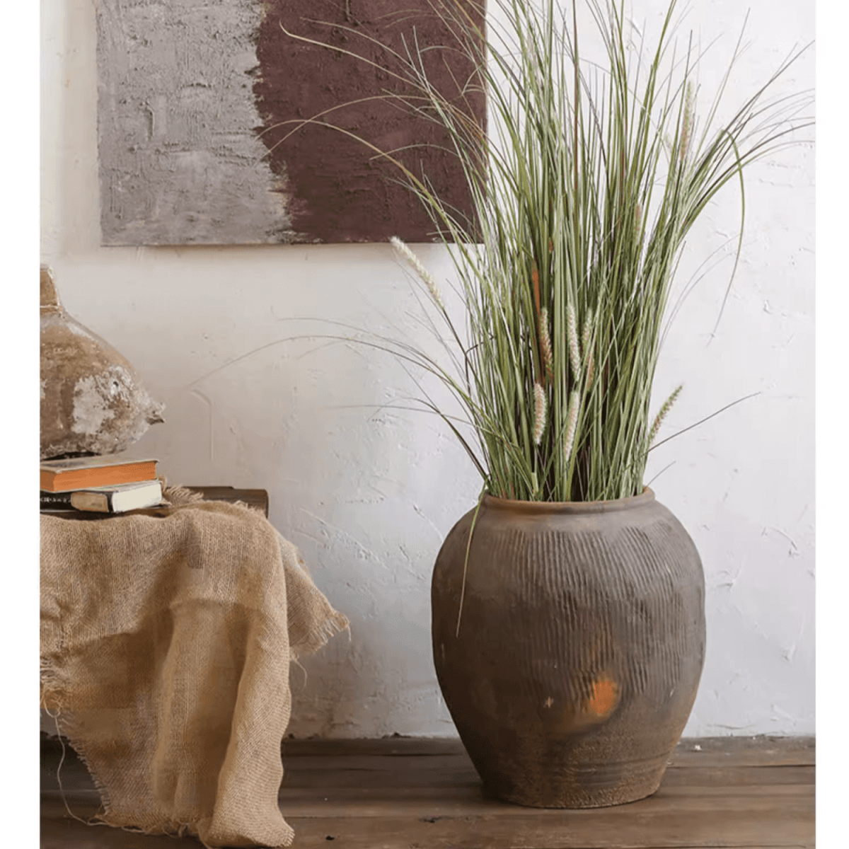 Round earthenware brown pot with ribbed texture by RusticReach filled with tall grasses on Tampa Home & Garden Store