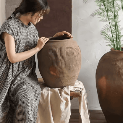 Round earthenware brown pots by RusticReach, textured vertical ridges, two shown on Tampa Home & Garden Store
