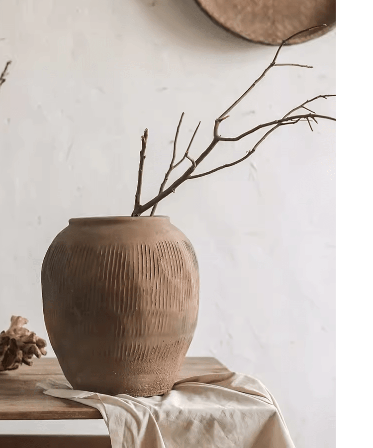 Round Earthenware Brown Pot by RusticReach with ribbed texture on wooden table holding branches on Tampa Home & Garden Store