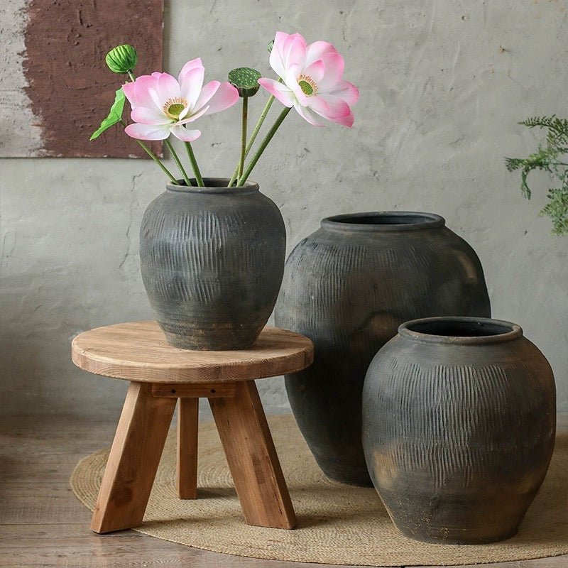Round earthenware gray pot set of 3 with textured ribbing on stool, rustic decor on Tampa Home & Garden Store