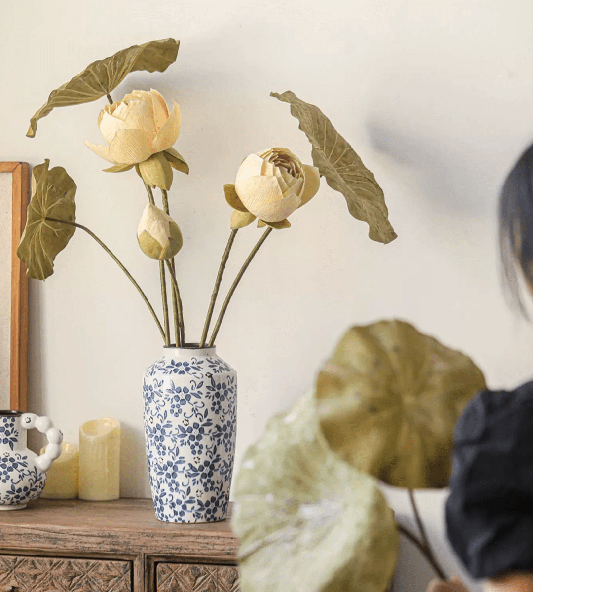 Artificial Rustic Lotus Stems by RusticReach in a blue floral vase with pale yellow blooms on Tampa Home & Garden Store