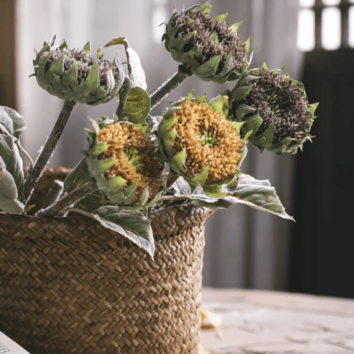 Artificial small-head sunflower stems RusticReach 23.6in tall with leaves in a woven basket on Tampa Home & Garden Store