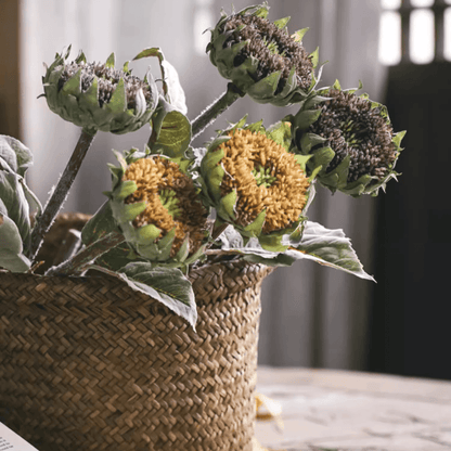 Artificial small-head sunflower stems RusticReach 23.6in tall with leaves in a woven basket on Tampa Home & Garden Store