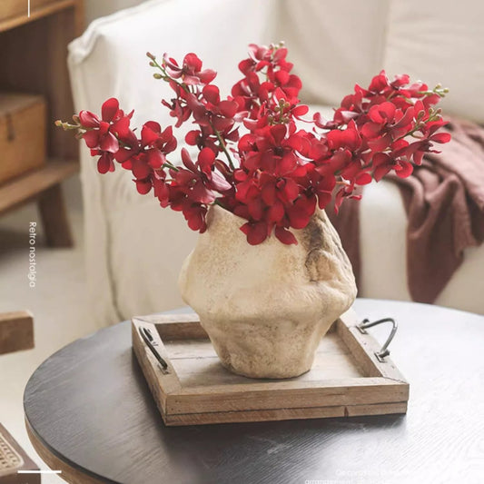 Single Red Orchid Stem by RusticReach, 24in tall in a textured beige vase on a wooden tray on Tampa Home & Garden Store