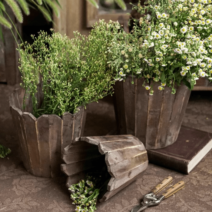 RusticReach spliced solid wood planter rounds with herbs and daisies on Tampa Home & Garden Store