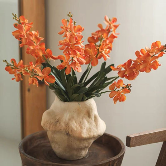 Faux Vanda Orchid Stem 24in tall with orange blooms in a beige textured vase by RusticReach on Tampa Home & Garden Store
