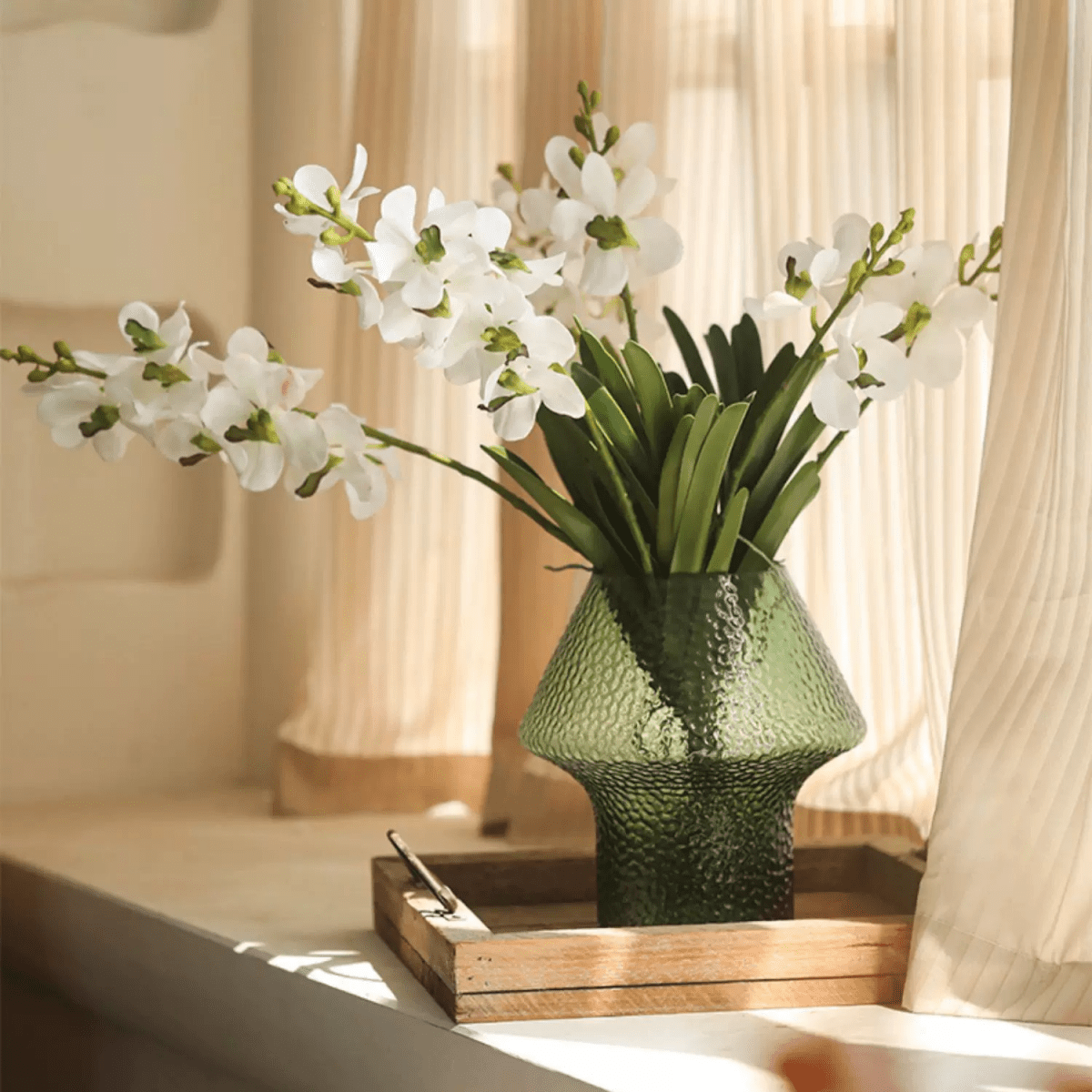Faux Vanda Orchid Stem 24\" Tall RusticReach green textured vase with white orchid sprays and green leaves on a wooden tray by a sunny window on Tampa Home & Garden Store