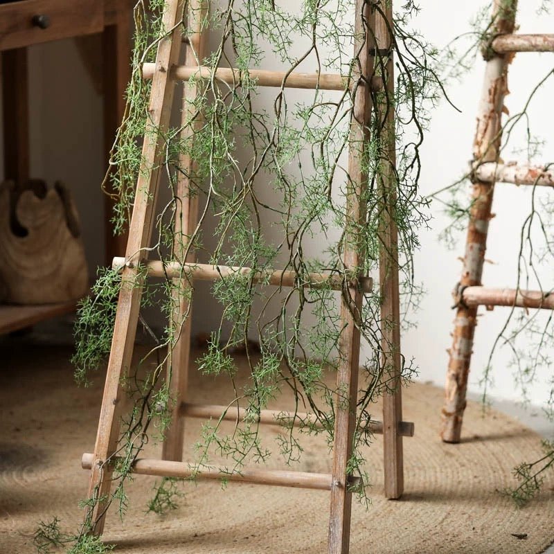 Artificial rattan vine decorative 55in long by RusticReach with green wisps on a ladder on Tampa Home & Garden Store