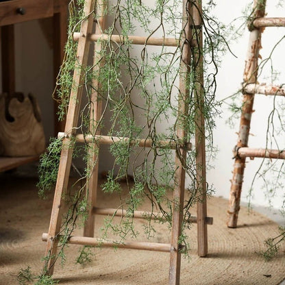 Artificial rattan vine decorative 55in long by RusticReach with green wisps on a ladder on Tampa Home & Garden Store