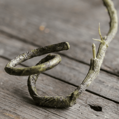 RusticReach artificial rattan vine green-brown twisted coils on weathered wood surface 55 inches long on Tampa Home & Garden Store