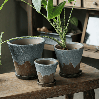 Weathered Heritage Flower Pot with Saucer set of three blue-grey planters on wood table on Tampa Home & Garden Store
