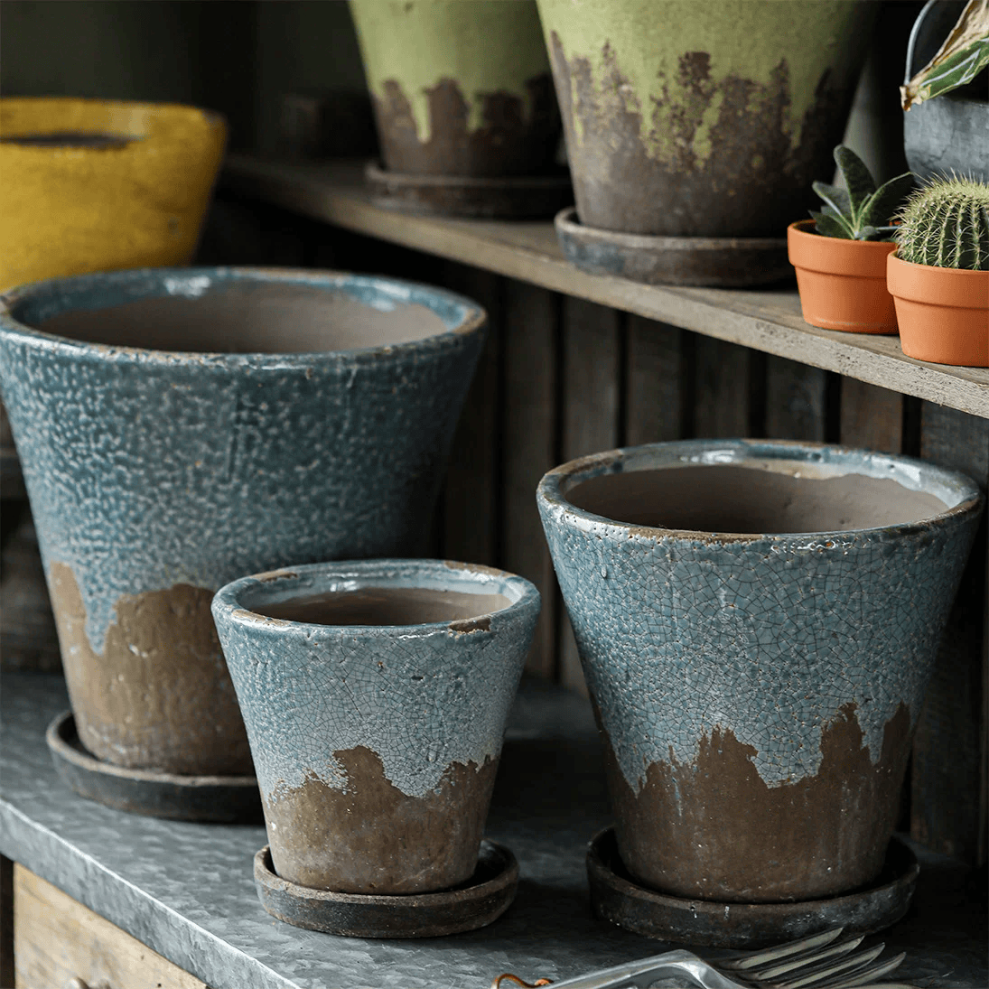 Weathered Heritage Flower Pot with Saucer set of three blue glazed planters with brown bases on Tampa Home & Garden Store
