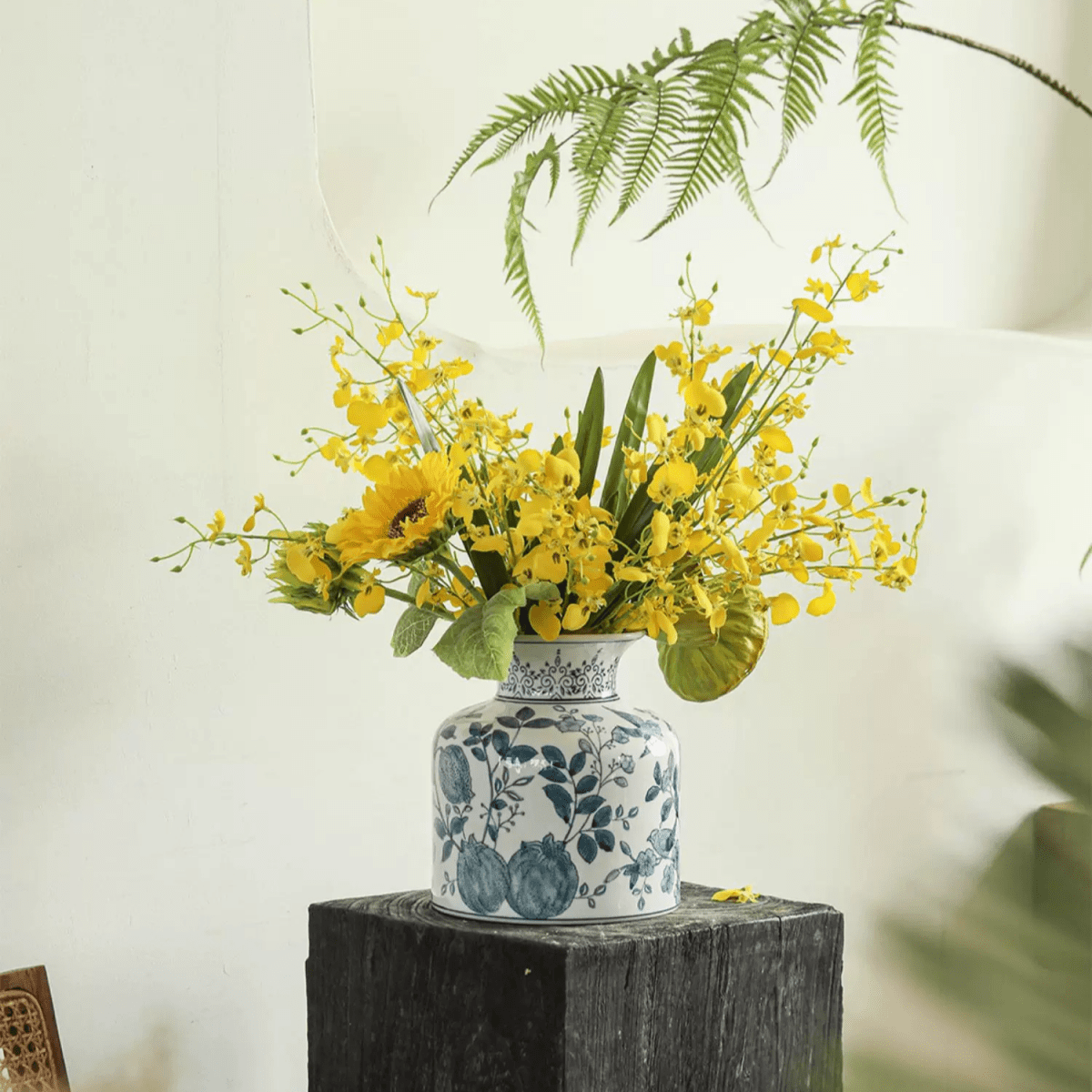Wendy's Dancing Lady Orchid bouquet in blue-and-white vase with yellow blooms RusticReach on Tampa Home & Garden Store