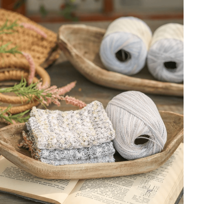 Retro wooden boat-shaped fruit platter with natural finish, 3 gray yarn skeins and towels on Tampa Home & Garden Store