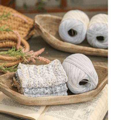 Retro wooden boat-shaped fruit platter with natural finish, 3 gray yarn skeins and towels on Tampa Home & Garden Store